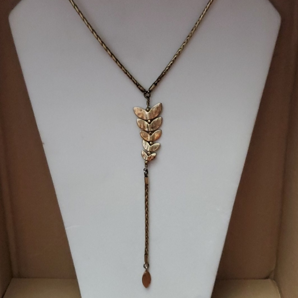 Gold metal fishtail necklace